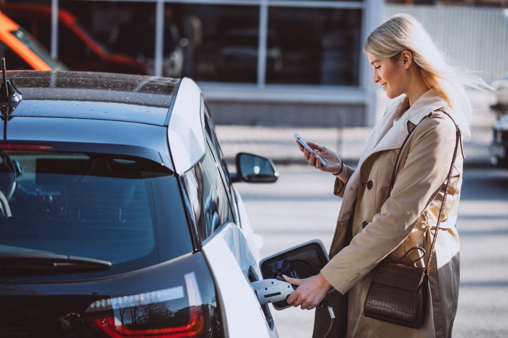 woman-charging-electro-car-electric-gas-station.jpg